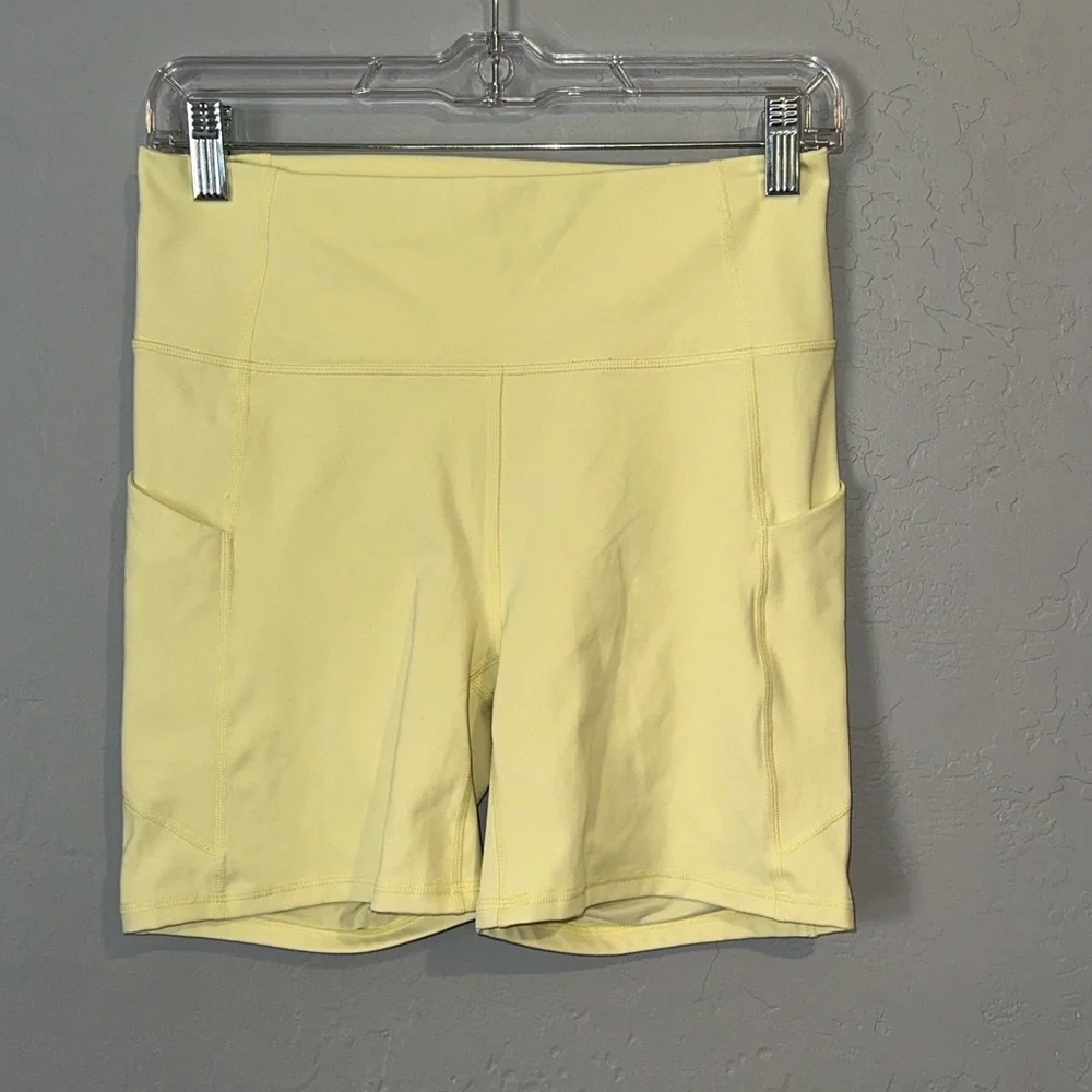 Fabletics Pale Yellow Bike Shorts with Side Pockets - Picture 1 of 6